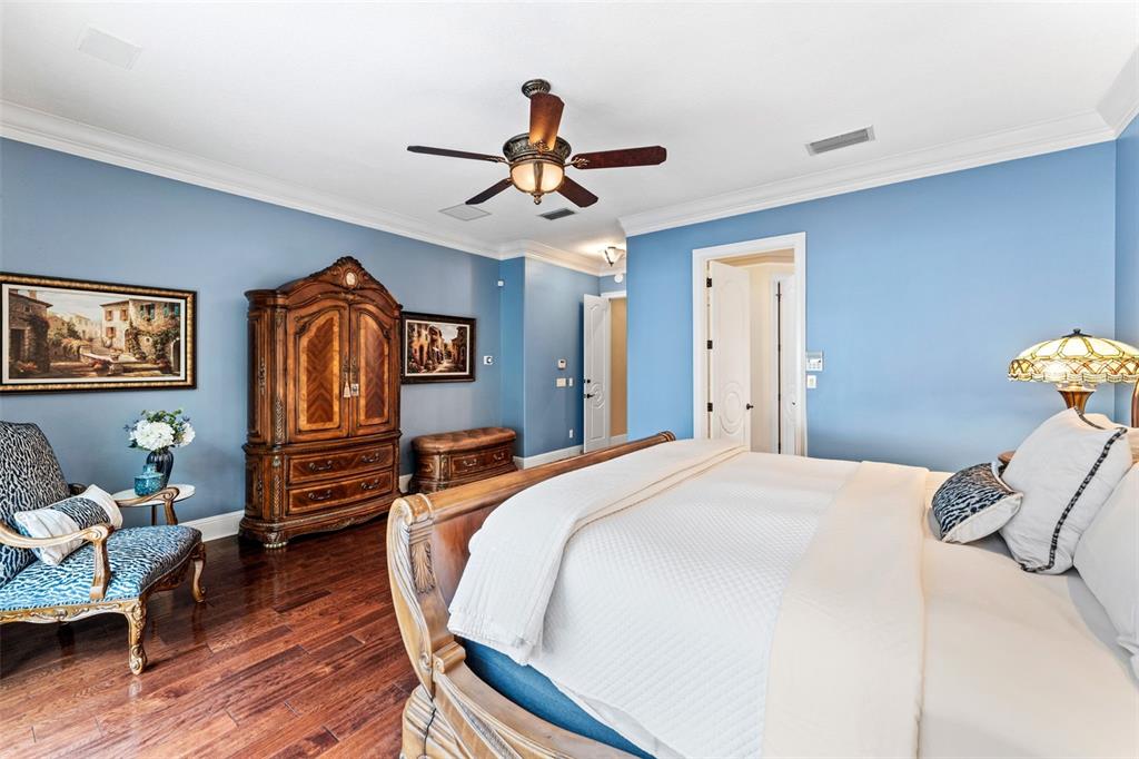 5070 Down Point Lane Windermere, FL 34786 - Photo 30 of 57 a bedroom with a bed and wooden floor