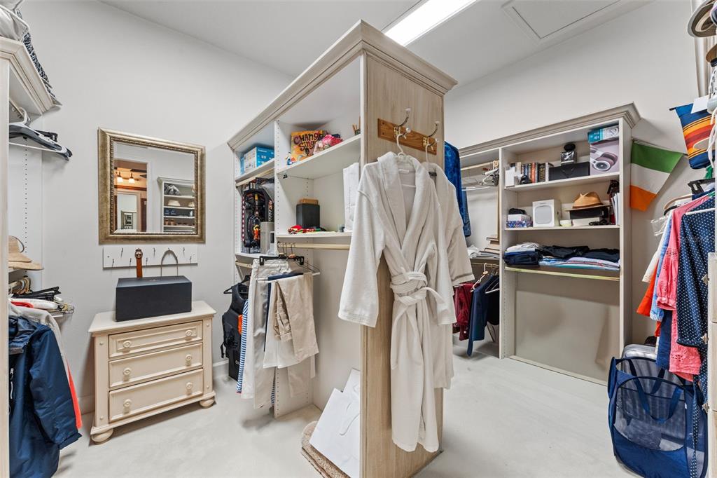 5070 Down Point Lane Windermere, FL 34786 - Photo 35 of 57 a view of walk in closet with clothes and shoes