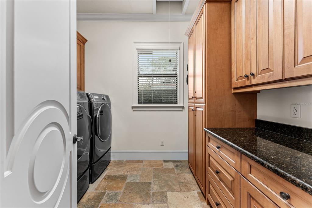 5070 Down Point Lane Windermere, FL 34786 - Photo 40 of 57 a utility room with wooden floor washer and dryer