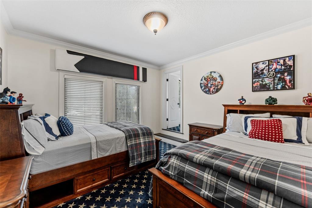 5070 Down Point Lane Windermere, FL 34786 - Photo 43 of 57 a bedroom with a bed and wooden floor