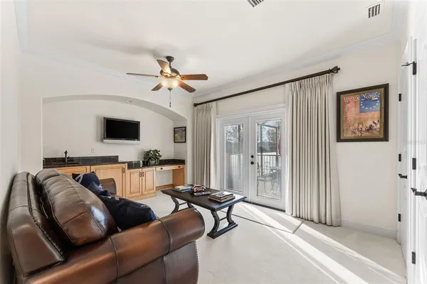 a bathroom with a granite countertop sink a mirror a vanity and a shower