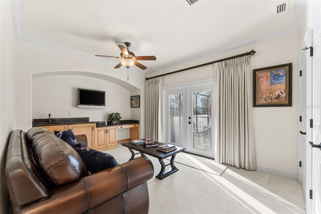 5070 Down Point Lane Windermere, FL 34786 - Photo 44 of 57 a living room with furniture and a flat screen tv