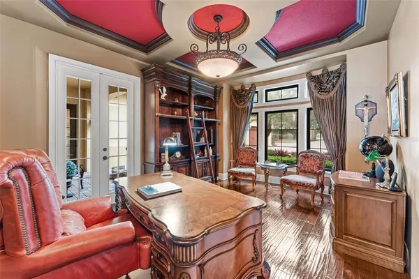 a living room with furniture a rug and a large window