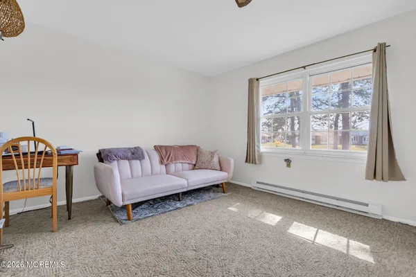 a living room with furniture and a window