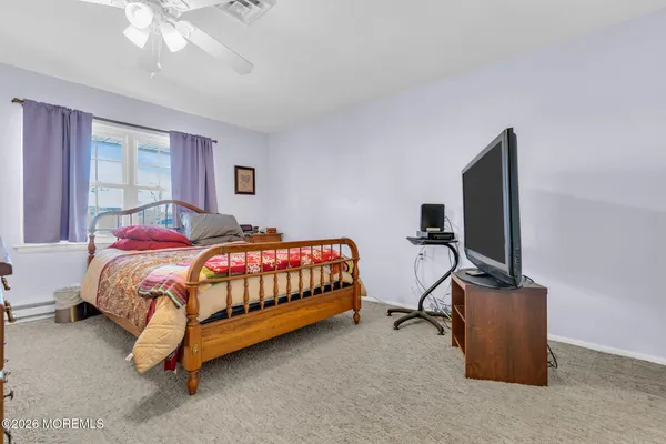 a bedroom with a bed and tv