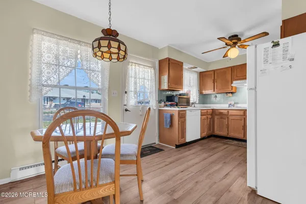 a kitchen with a window a sink and a refrigerator