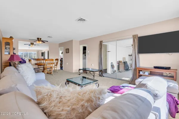 a bed room with a bed and a flat screen tv