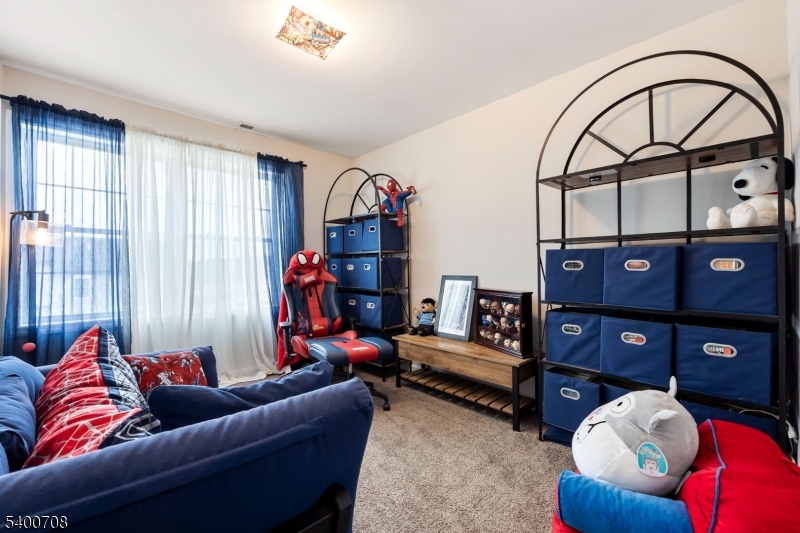 4 Gregg Court Newton, NJ 07860 - Photo 15 of 22 a living room with furniture a couch and a bookshelf