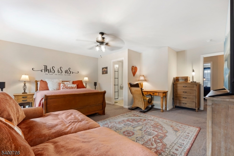 4 Gregg Court Newton, NJ 07860 - Photo 17 of 22 a bed room with furniture and a chandelier