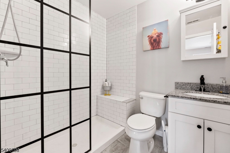 4 Gregg Court Newton, NJ 07860 - Photo 19 of 22 a bathroom with a toilet sink vanity and mirror