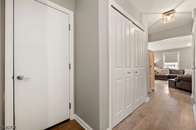a view of a livingroom with furniture and hardwood floor