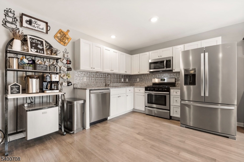 4 Gregg Court Newton, NJ 07860 - Photo 9 of 22 a kitchen with stainless steel appliances a stove a microwave and a refrigerator
