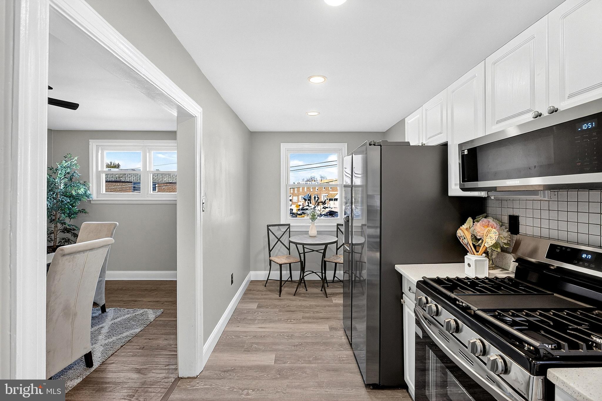 3901 Elson Road Brookhaven, PA 19015 - Photo 18 of 47 a kitchen with stainless steel appliances granite countertop a stove and a refrigerator