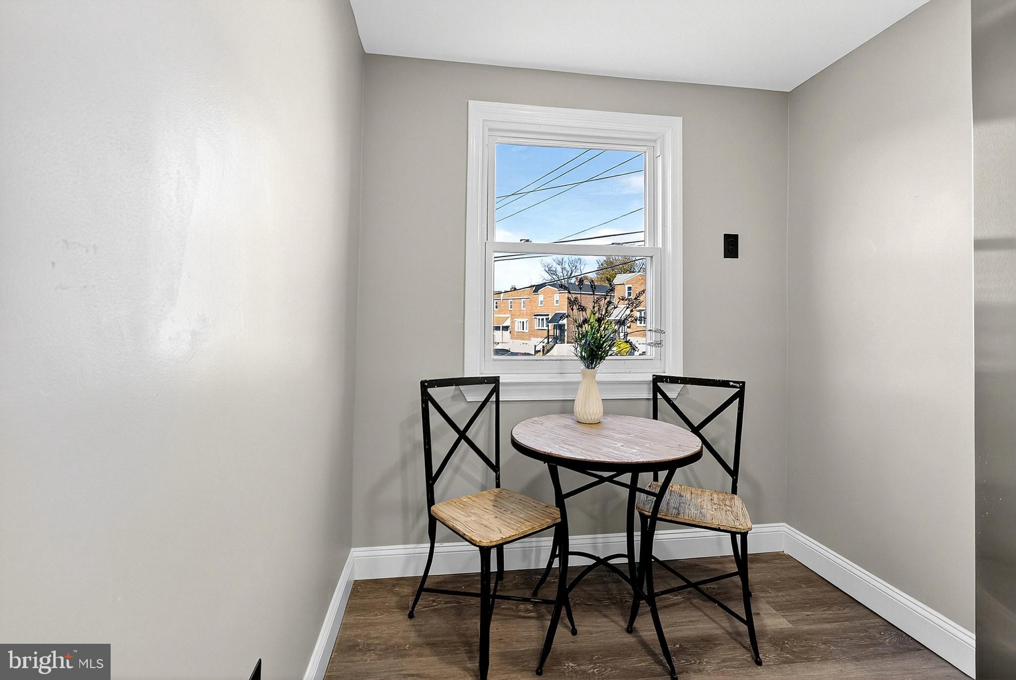 3901 Elson Road Brookhaven, PA 19015 - Photo 20 of 47 a view of a room with a table and chairs in wooden floor