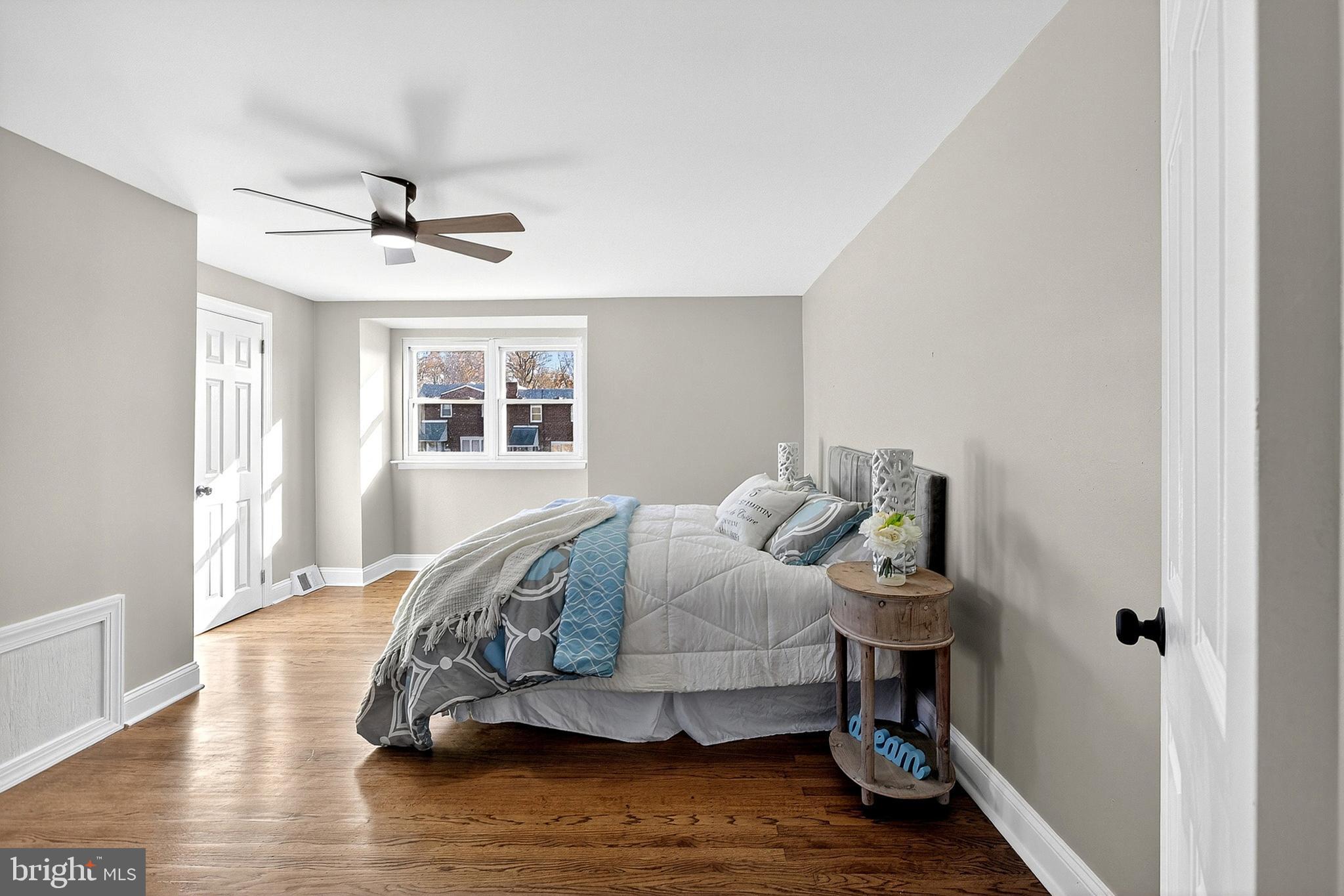 3901 Elson Road Brookhaven, PA 19015 - Photo 21 of 47 a bedroom with a bed and wooden floor
