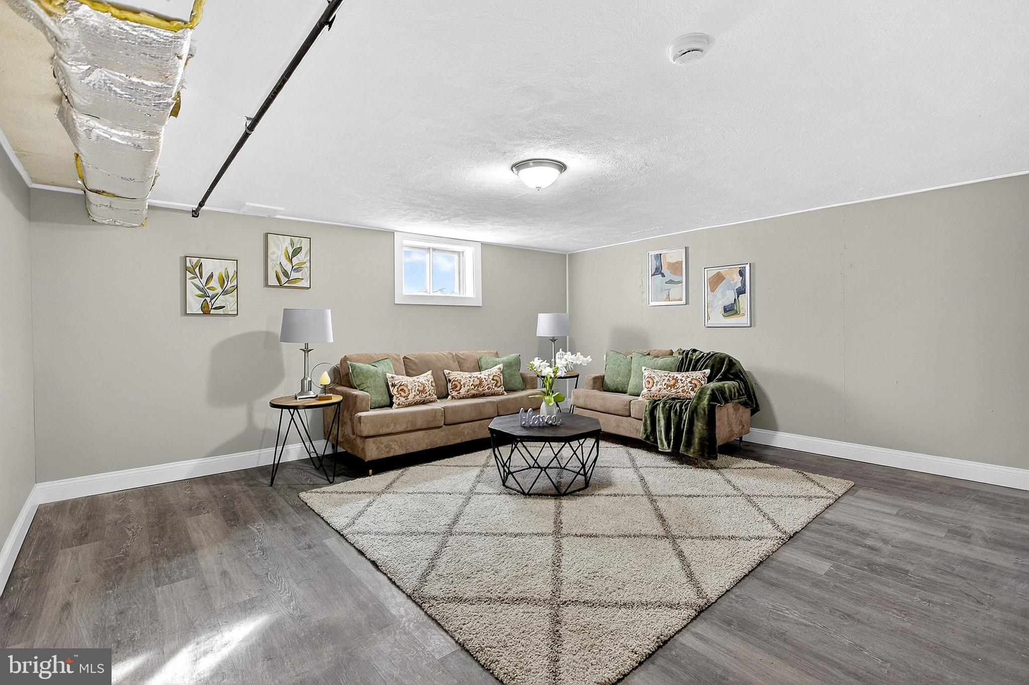 3901 Elson Road Brookhaven, PA 19015 - Photo 36 of 47 a living room with furniture and a rug