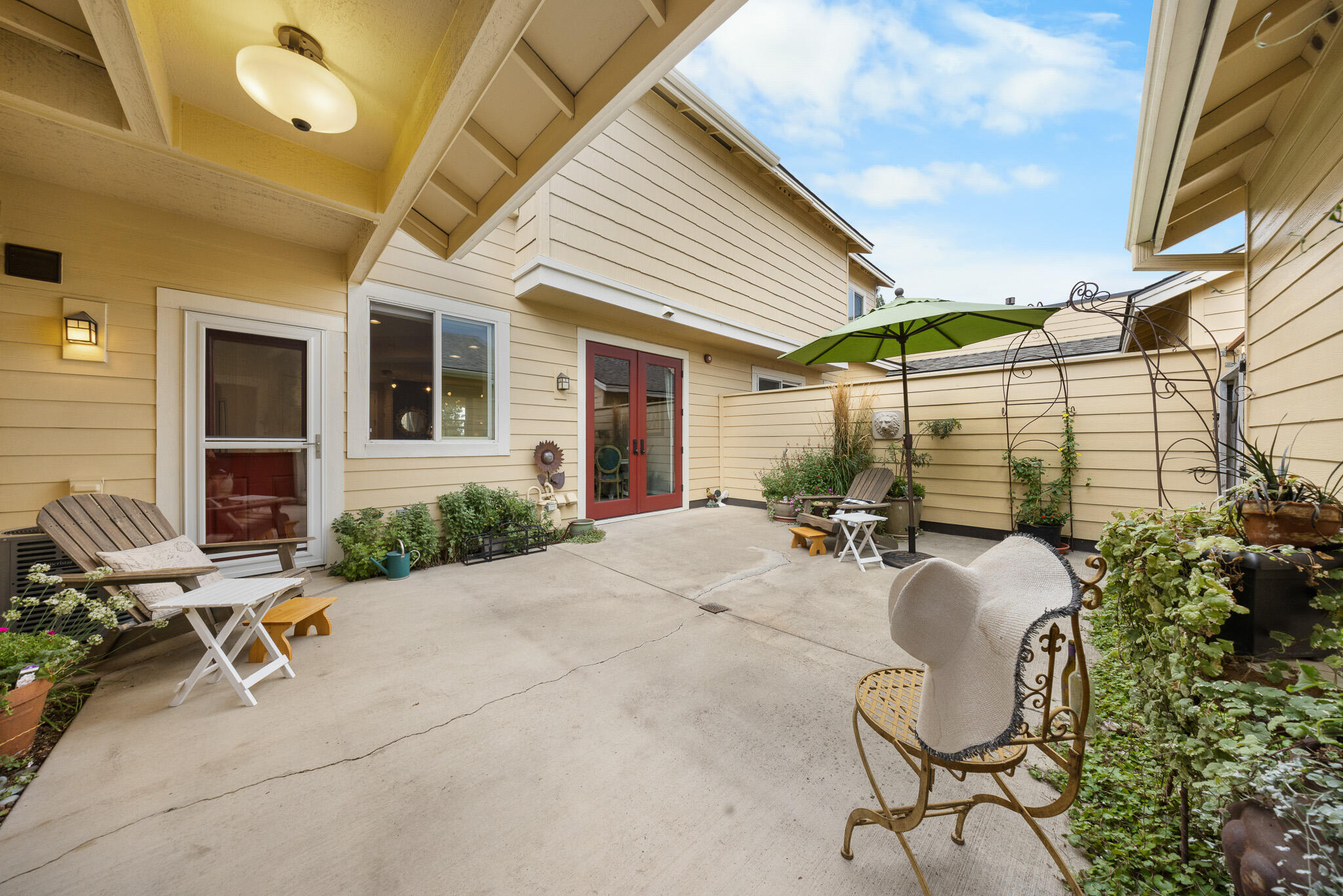 624 Southwest Hill Street Bend, OR 97702 - Photo 37 of 45 a view of a patio with table and chairs and potted plants