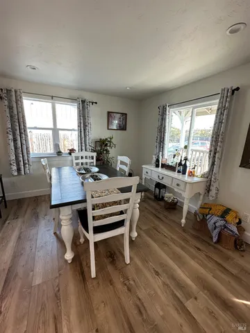 a kitchen with stainless steel appliances a sink a stove a microwave and cabinets