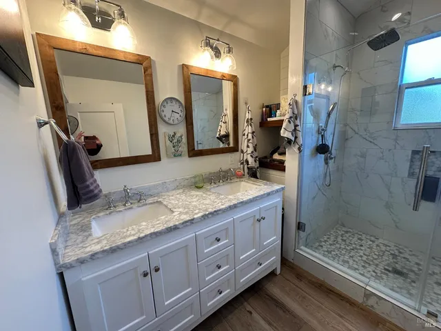 a bedroom with a bed next to a window