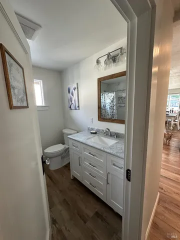 a backyard of a house with table and chairs