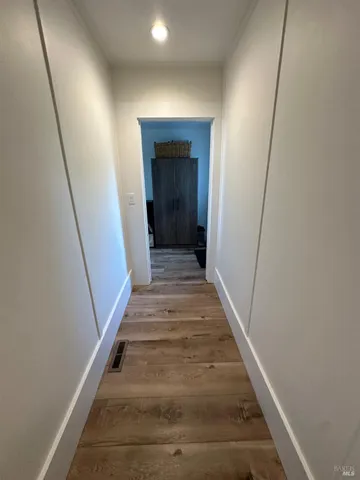 a view of a house with wooden deck