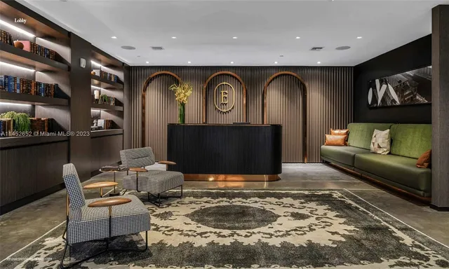 a living room with fireplace furniture and a rug