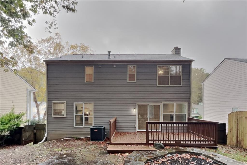 5105 North Bridges Drive Alpharetta, GA 30022 - Photo 18 of 21 a front view of a house with a garden