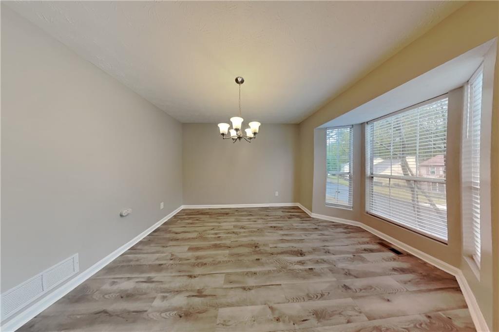 5105 North Bridges Drive Alpharetta, GA 30022 - Photo 6 of 21 a view of an empty room with a window