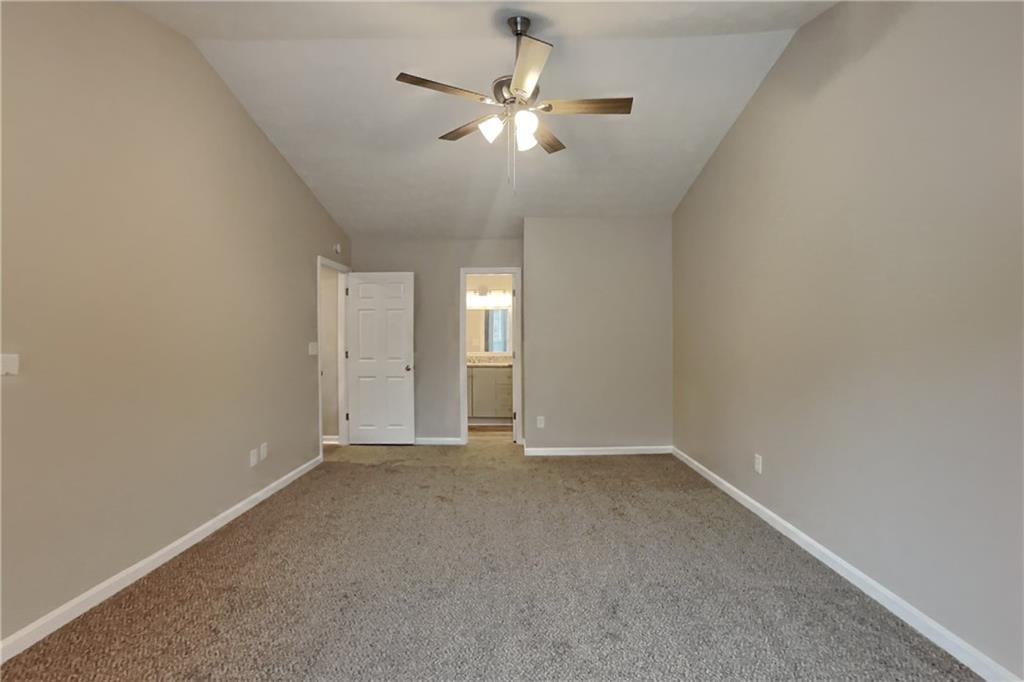 5105 North Bridges Drive Alpharetta, GA 30022 - Photo 8 of 21 an empty room with fan and windows