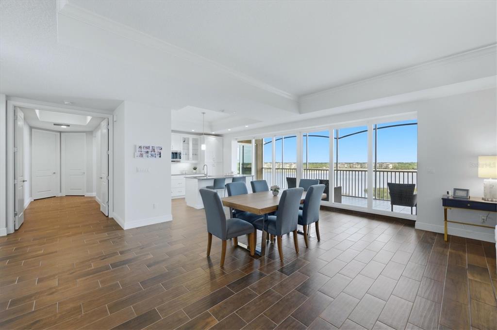 10510 Boardwalk Loop, Unit 602 Lakewood Ranch, FL 34202 - Photo 15 of 77 a view of a dining room with furniture and wooden floor
