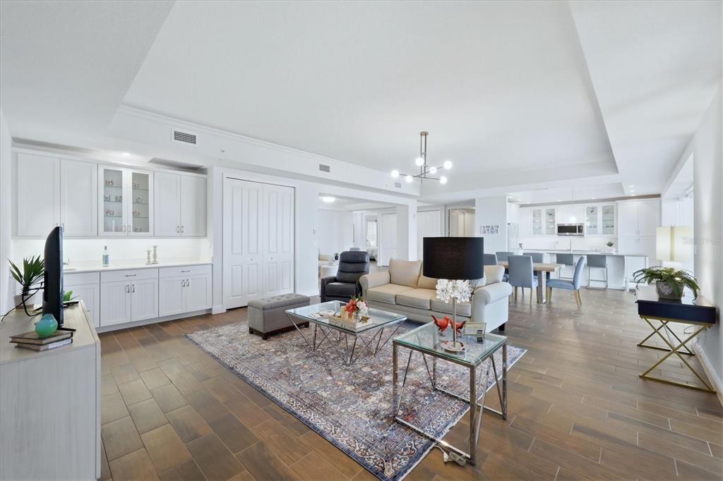 10510 Boardwalk Loop, Unit 602 Lakewood Ranch, FL 34202 - Photo 19 of 77 a living room with furniture and a chandelier