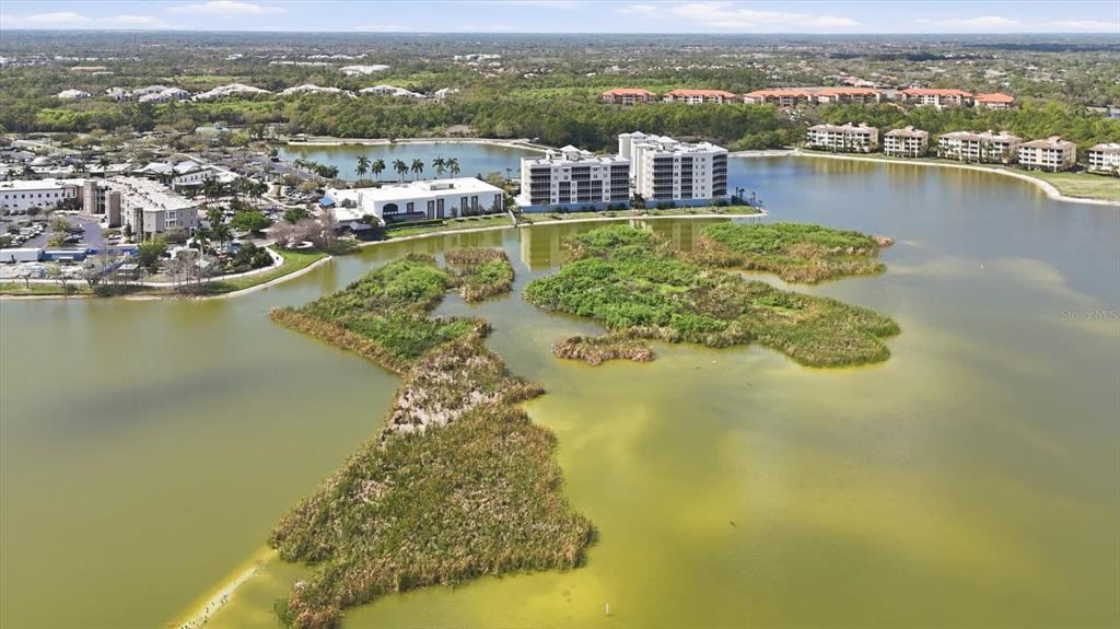10510 Boardwalk Loop, Unit 602 Lakewood Ranch, FL 34202 - Photo 2 of 77 an aerial view of residential houses with outdoor space and ocean view