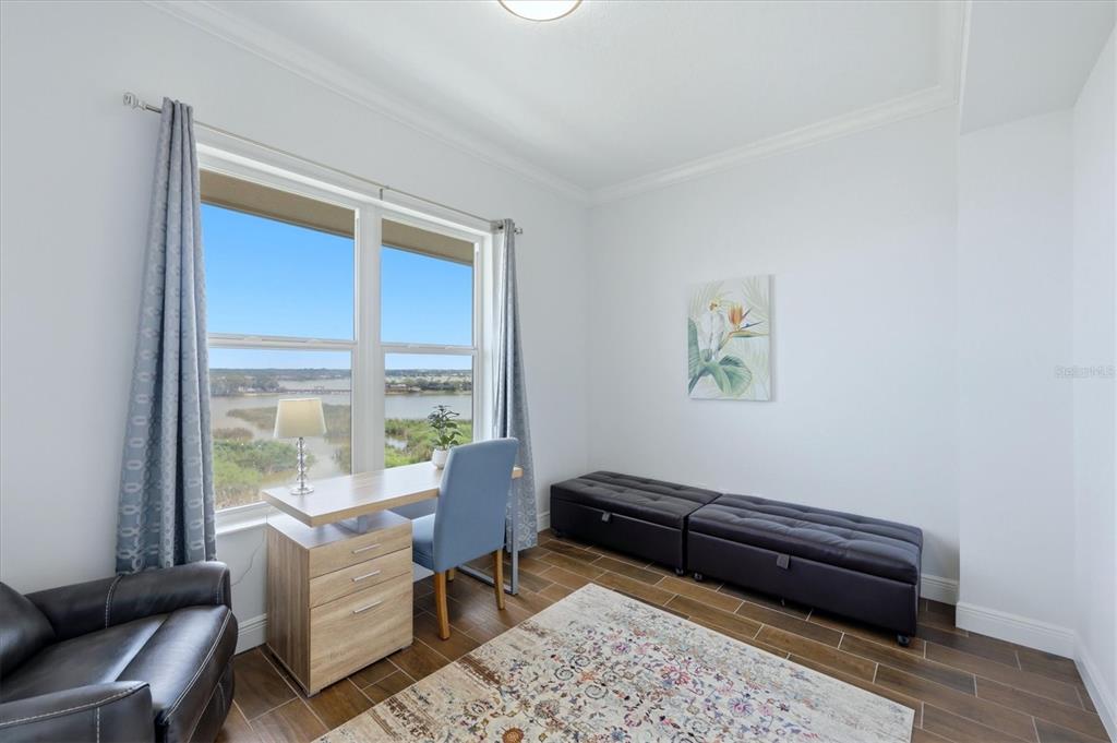10510 Boardwalk Loop, Unit 602 Lakewood Ranch, FL 34202 - Photo 25 of 77 a living room with furniture and a window