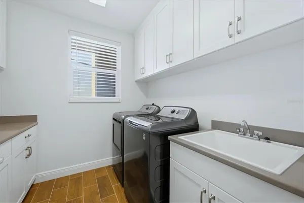 a kitchen with a table and chairs in it