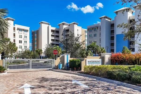 a front view of a building with outdoor space and ocean view