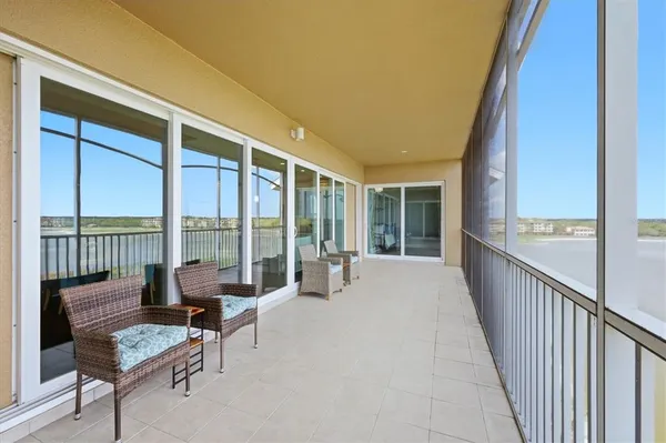 a view of a house with swimming pool and sitting area