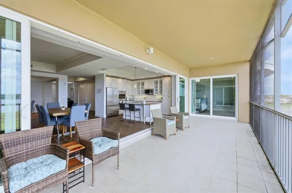 a view of a swimming pool with a patio and a yard
