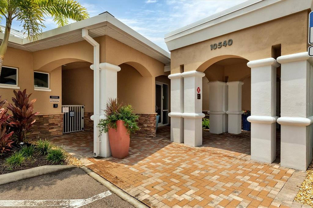 10510 Boardwalk Loop, Unit 602 Lakewood Ranch, FL 34202 - Photo 45 of 77 a view of a house with entryway and potted plants
