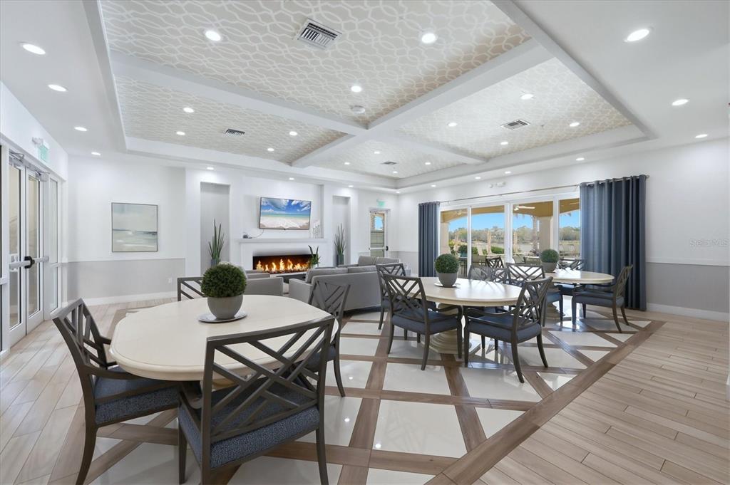 10510 Boardwalk Loop, Unit 602 Lakewood Ranch, FL 34202 - Photo 47 of 77 a view of a dining room with furniture