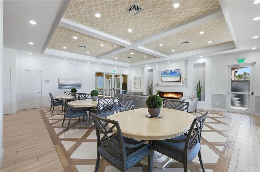 10510 Boardwalk Loop, Unit 602 Lakewood Ranch, FL 34202 - Photo 48 of 77 a view of a dining room with furniture and wooden floor