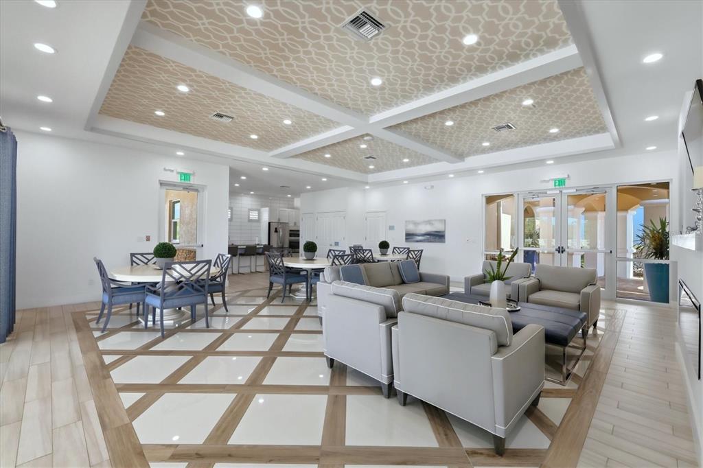 10510 Boardwalk Loop, Unit 602 Lakewood Ranch, FL 34202 - Photo 49 of 77 a living room with lots of furniture and a large window