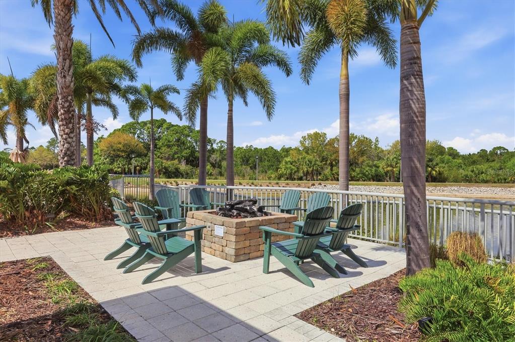 10510 Boardwalk Loop, Unit 602 Lakewood Ranch, FL 34202 - Photo 56 of 77 a view of a backyard with sitting area and furniture