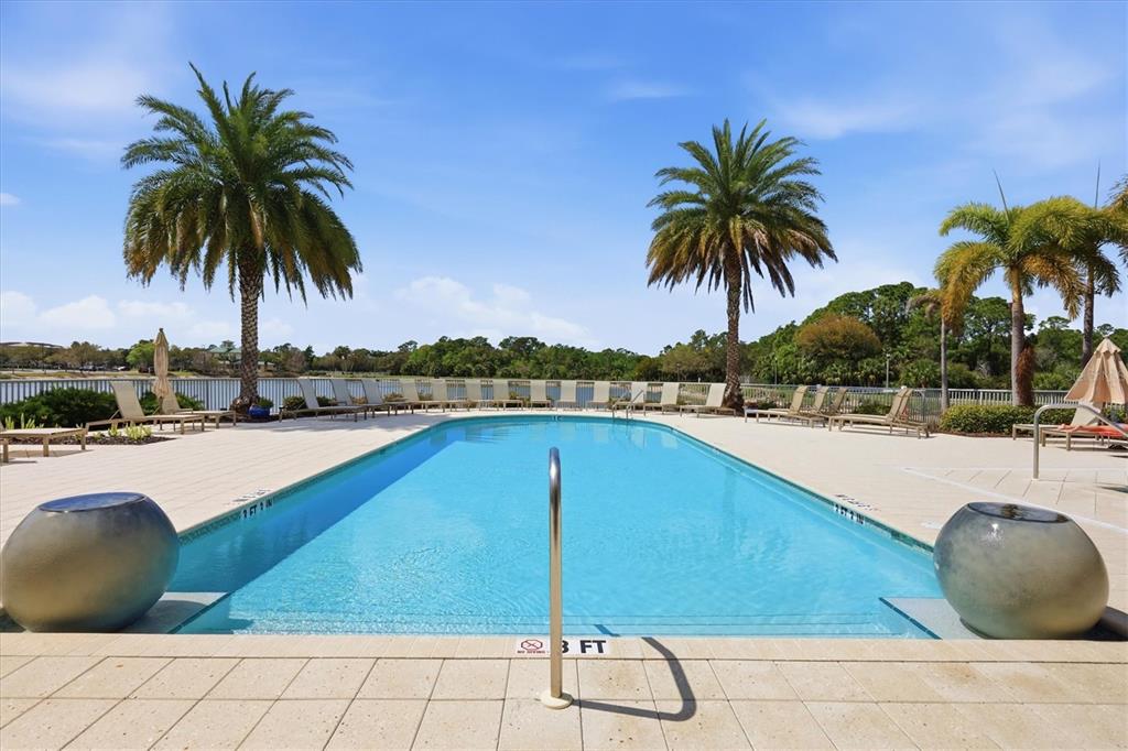 10510 Boardwalk Loop, Unit 602 Lakewood Ranch, FL 34202 - Photo 59 of 77 a view of a swimming pool and a chair