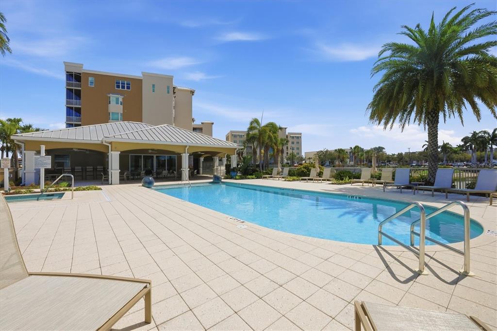 10510 Boardwalk Loop, Unit 602 Lakewood Ranch, FL 34202 - Photo 60 of 77 a view of a house with pool and sitting area