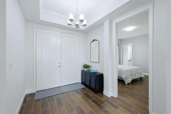 a large kitchen with kitchen island a large window in it and a dining table