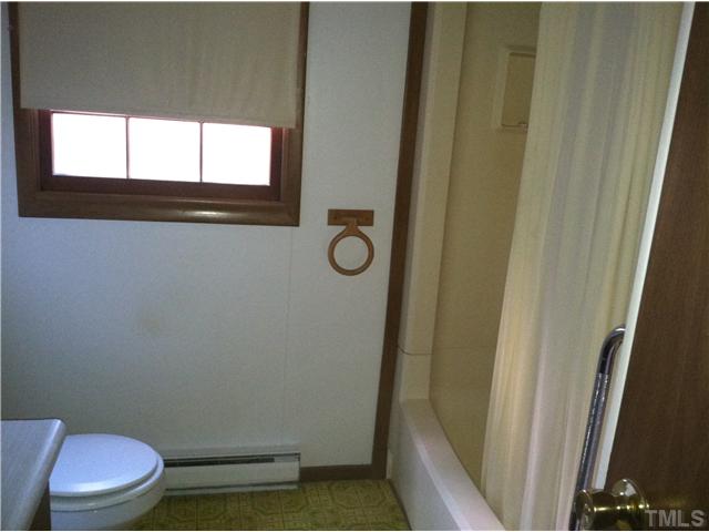 757 Ivey Day Road Roxboro, NC 27574 - Photo 4 of 4 a bathroom with a toilet and a shower