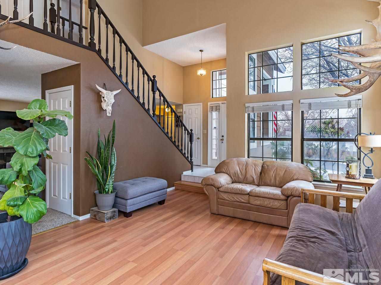 1703 Terrace Heights Lane Reno, NV 89523 - Photo 3 of 13 a living room with furniture and a potted plant