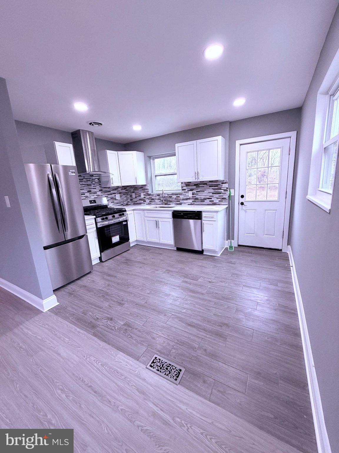 3507 Riviera Street Temple Hills, MD 20748 - Photo 2 of 7 Modern kitchen with sleek finishes.