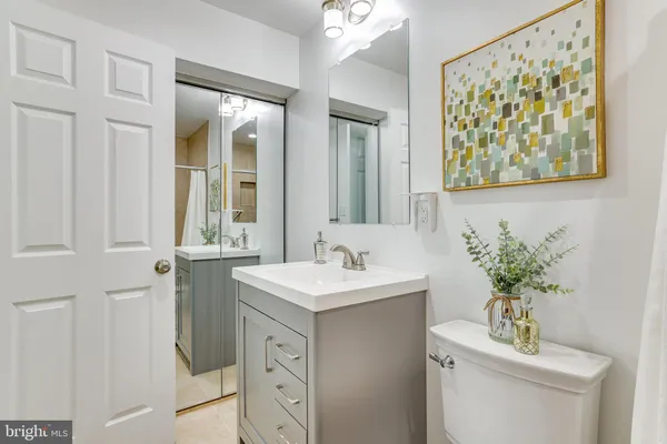 a large kitchen with granite countertop lots of counter top space stainless steel appliances and windows