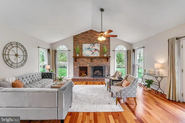 a living room with furniture and a dining table